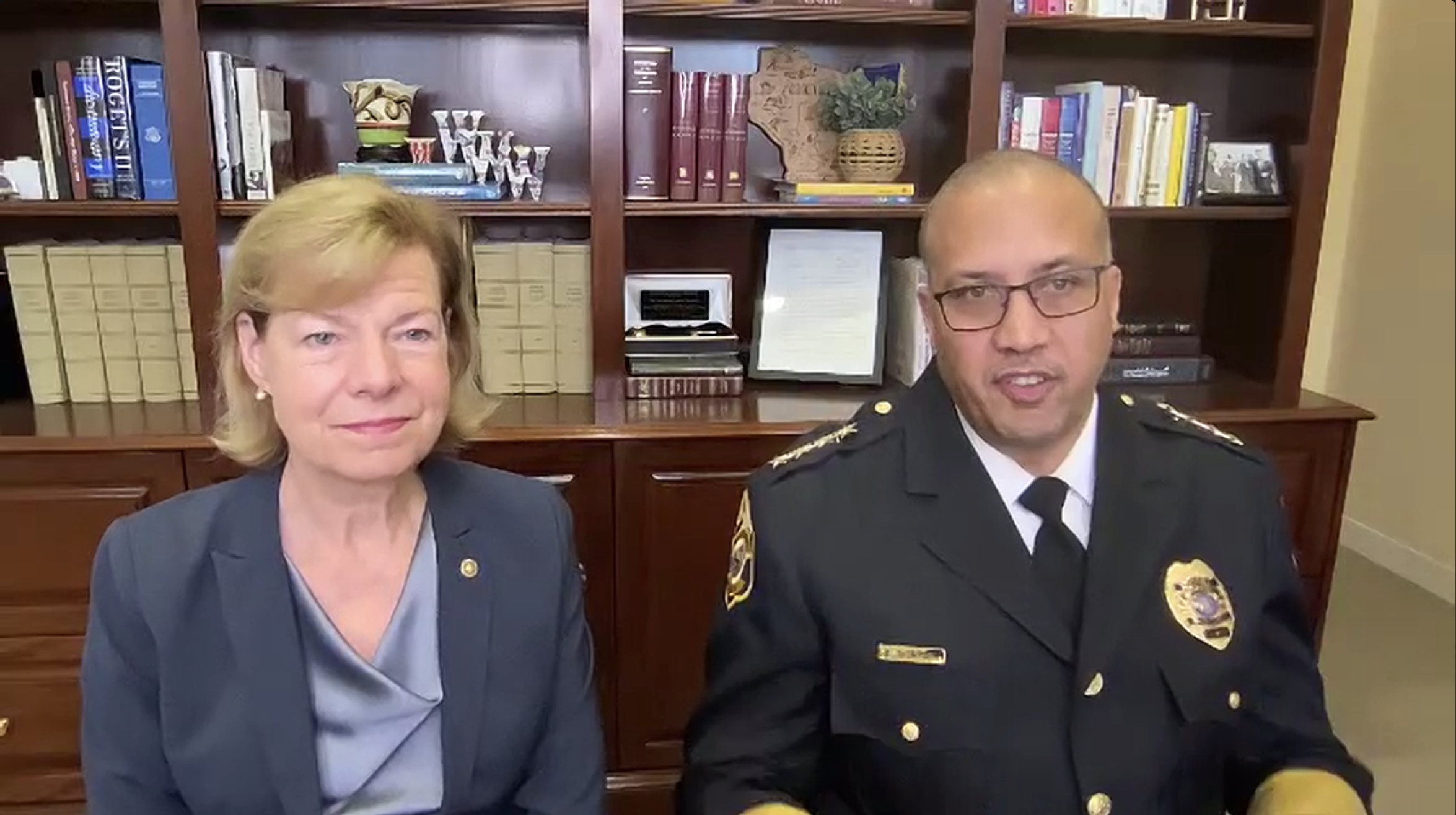 U.S. Sen. Tammy Baldwin and Waukesha Police Chief Daniel Thompson sit in an office in Washington D.C. during a Zoom call.